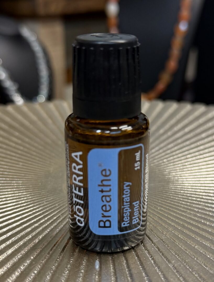 A small bottle of doTERRA Breathe Respiratory Blend essential oil.
